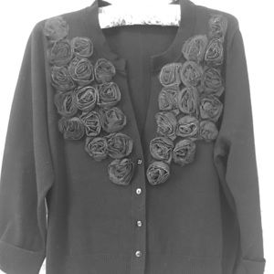 Black V neck cardigan embellished with roses.